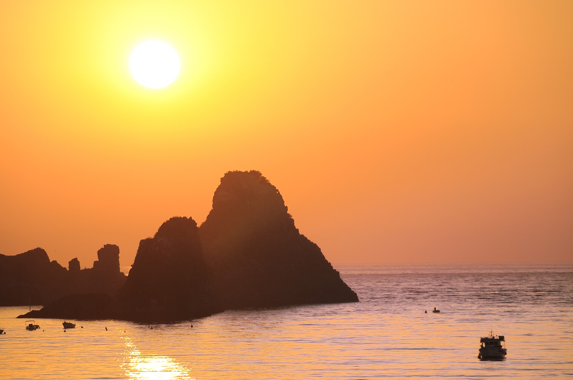 Basalt stacks (Faraglioni dei Ciclopi) off Aci Trezza near Catania, natural must-see sight