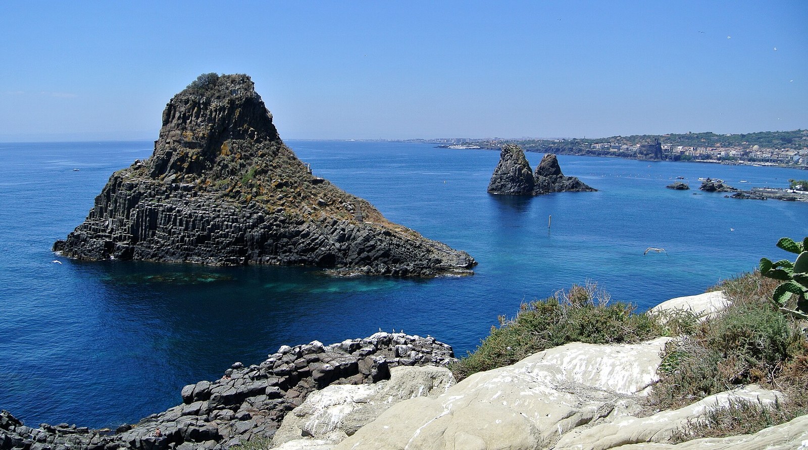 Faraglioni rock stacks at Aci Trezza near Catania, the legendary Cyclops Islands