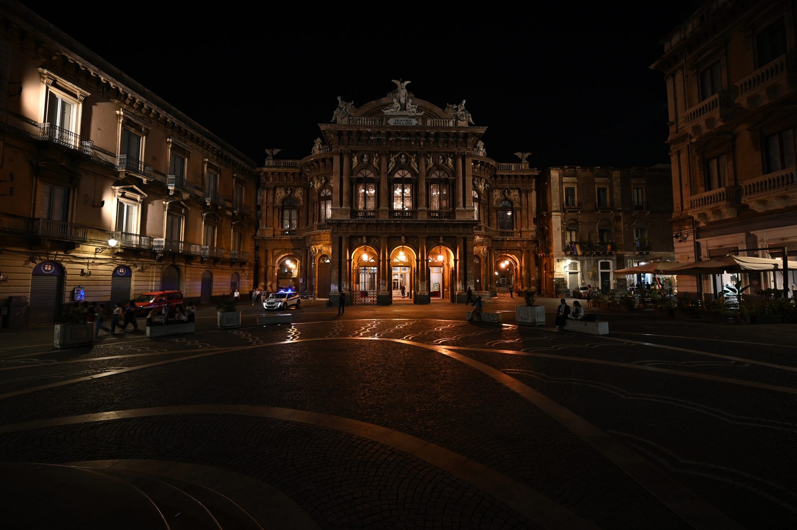 Catania city hall on Piazza Università illuminated at night — the anchor square of Catania nightlife