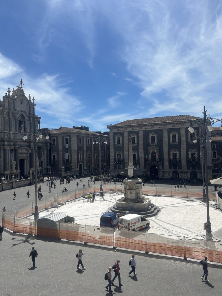 Piazza del Duomo in Catania's old town at sunrise with Cathedral of Sant'Agata and the Liotru elephant fountain, baroque black lava stone and white limestone