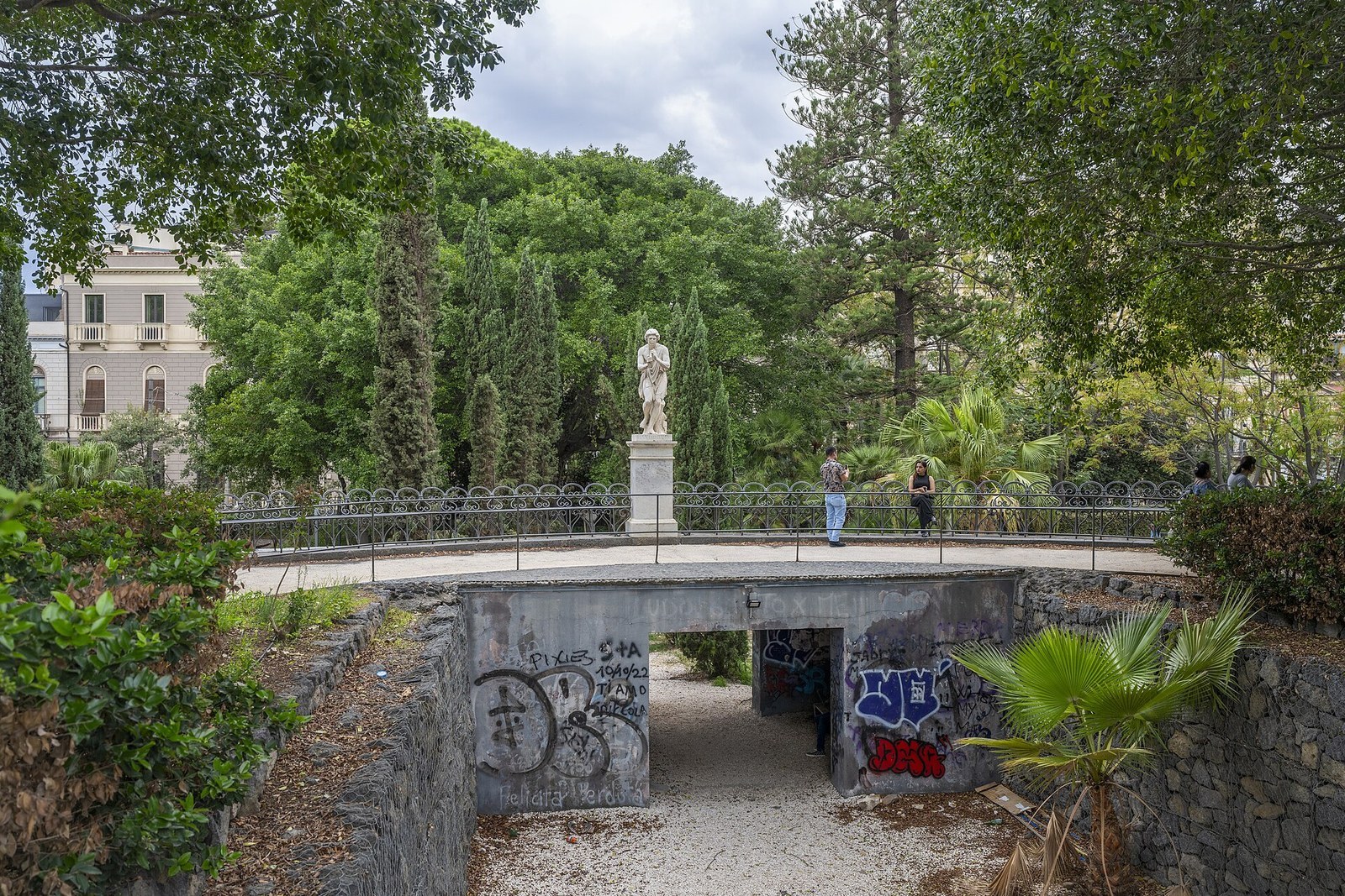 Villa Bellini public gardens in Catania old town, 1883 park dedicated to composer Vincenzo Bellini with ficus trees, bandstand and flower clock