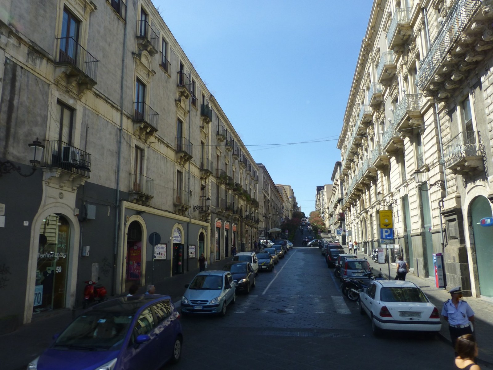 Via Etnea shopping street in Catania with Mount Etna in the background Sicily