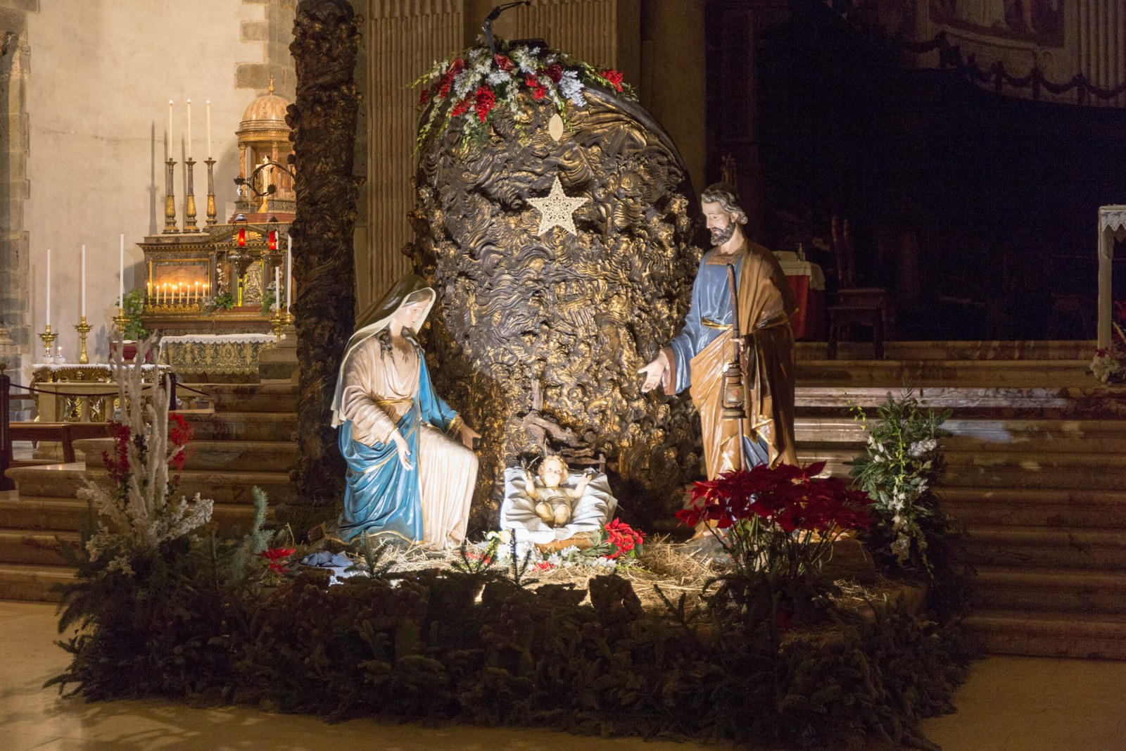 Christmas nativity scene in the apse of Catania Cathedral — a presepe set inside the Cattedrale di Sant'Agata during the December holiday season in Sicily