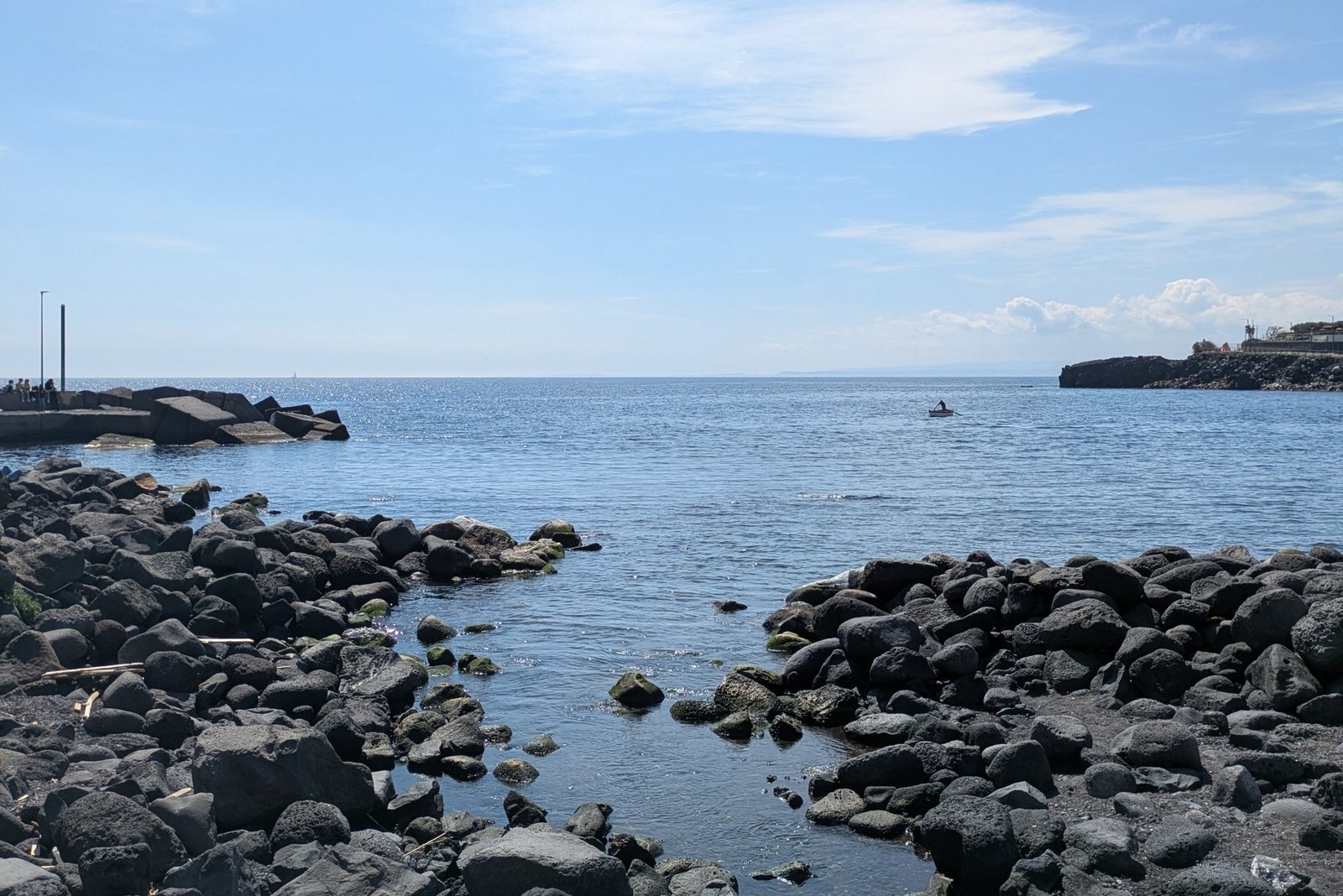 San Giovanni Li Cuti black volcanic beach in Catania with fishing boats - hidden gem
