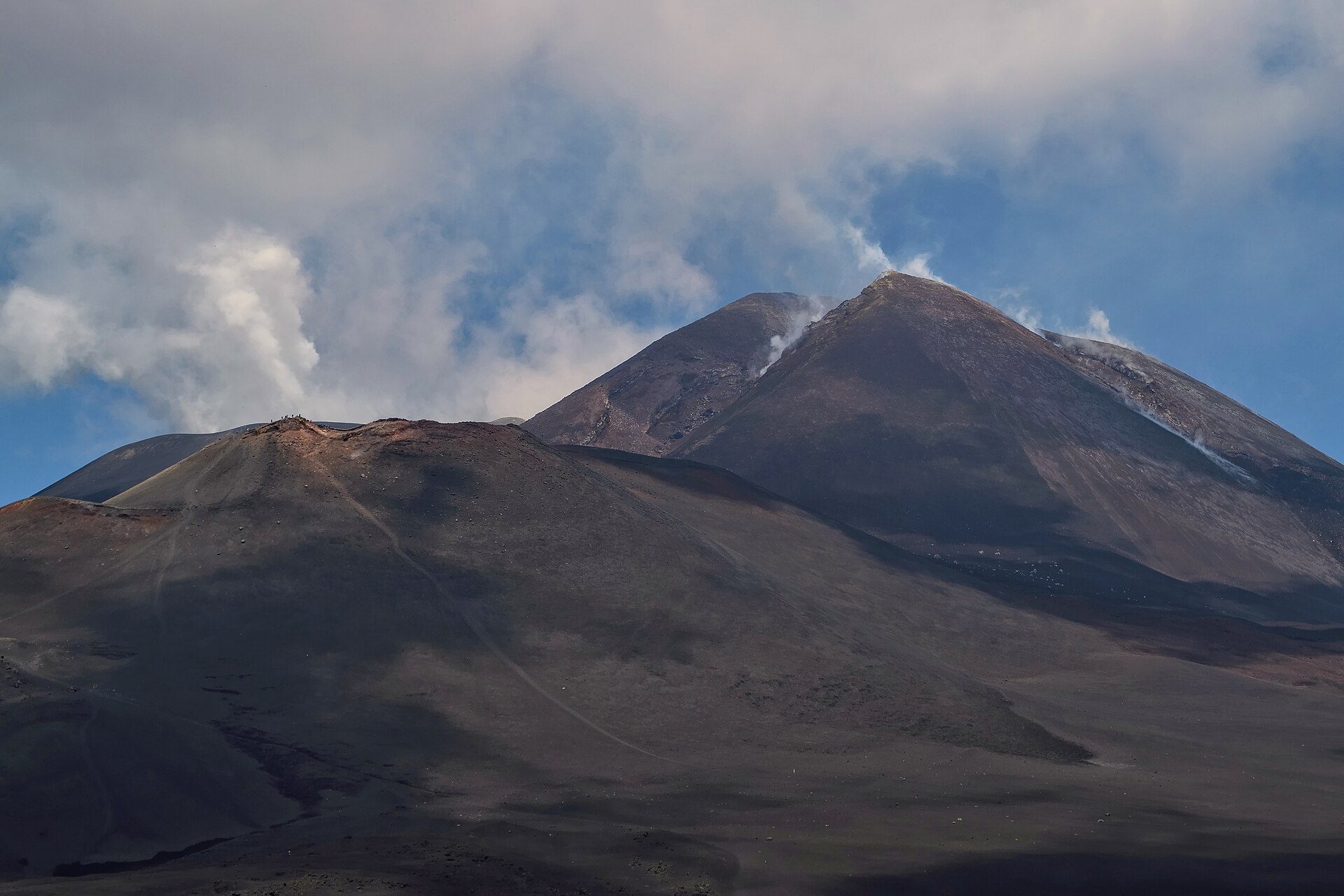 Mount Etna summit craters with fumaroles seen from the upper hiking area