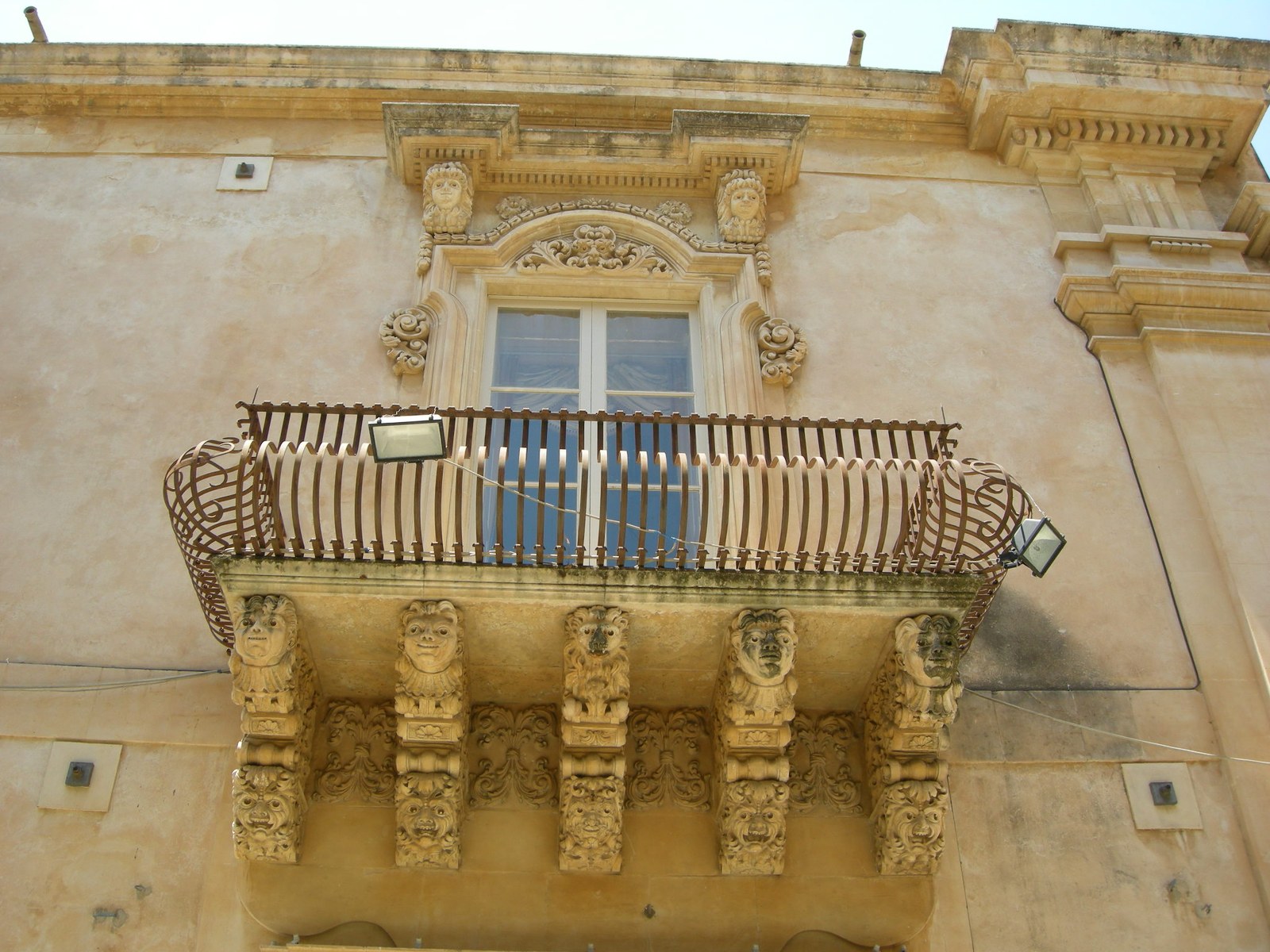 Palazzo Nicolaci di Villadorata in Noto, close-up of baroque balcony with mascheroni — Sicily honeymoon Val di Noto
