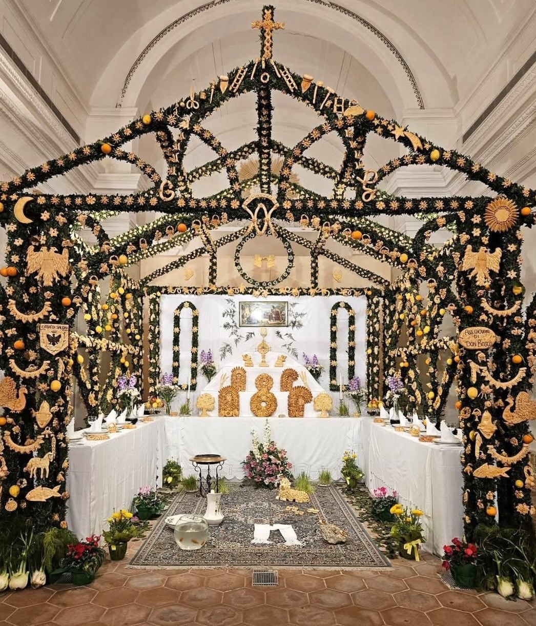 Altar of San Giuseppe in Salemi on March 19 — traditional Sicilian table piled with bread sculptures, oranges, lemons and laurel sprigs for St Joseph's Day