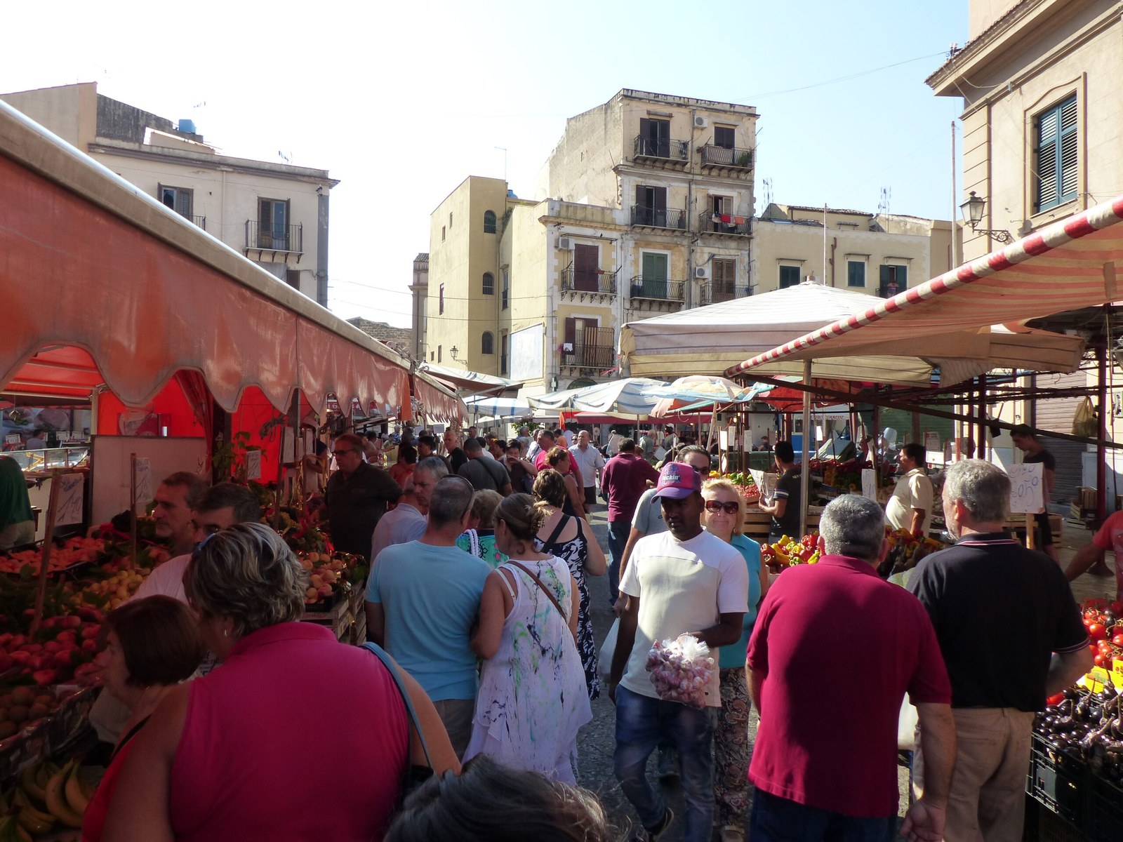 Vendors and shoppers at Ballarò street market in Palermo, Sicily