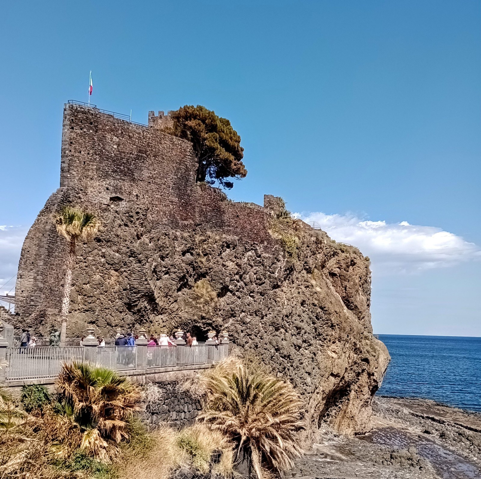 Aci Castello Norman castle above the rocky beach near Catania