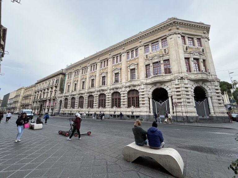 Via Etnea street view in Catania with parked cars
