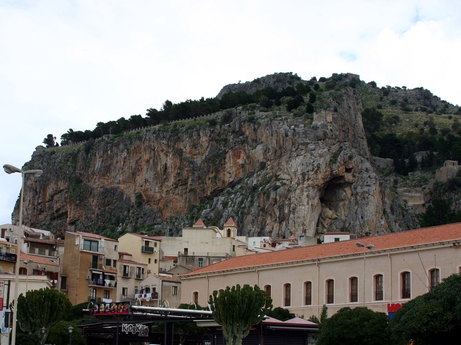 La Rocca of Cefalù towering over the Norman Cathedral and the fishing village on Sicily's Tyrrhenian coast — a typical April hike with mild spring weather