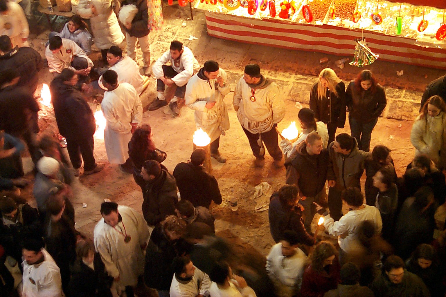 Devotees await the passage of the Fercolo of Sant'Agata along Via Etnea in Catania — the silver bust paraded through the historic centre on February 5
