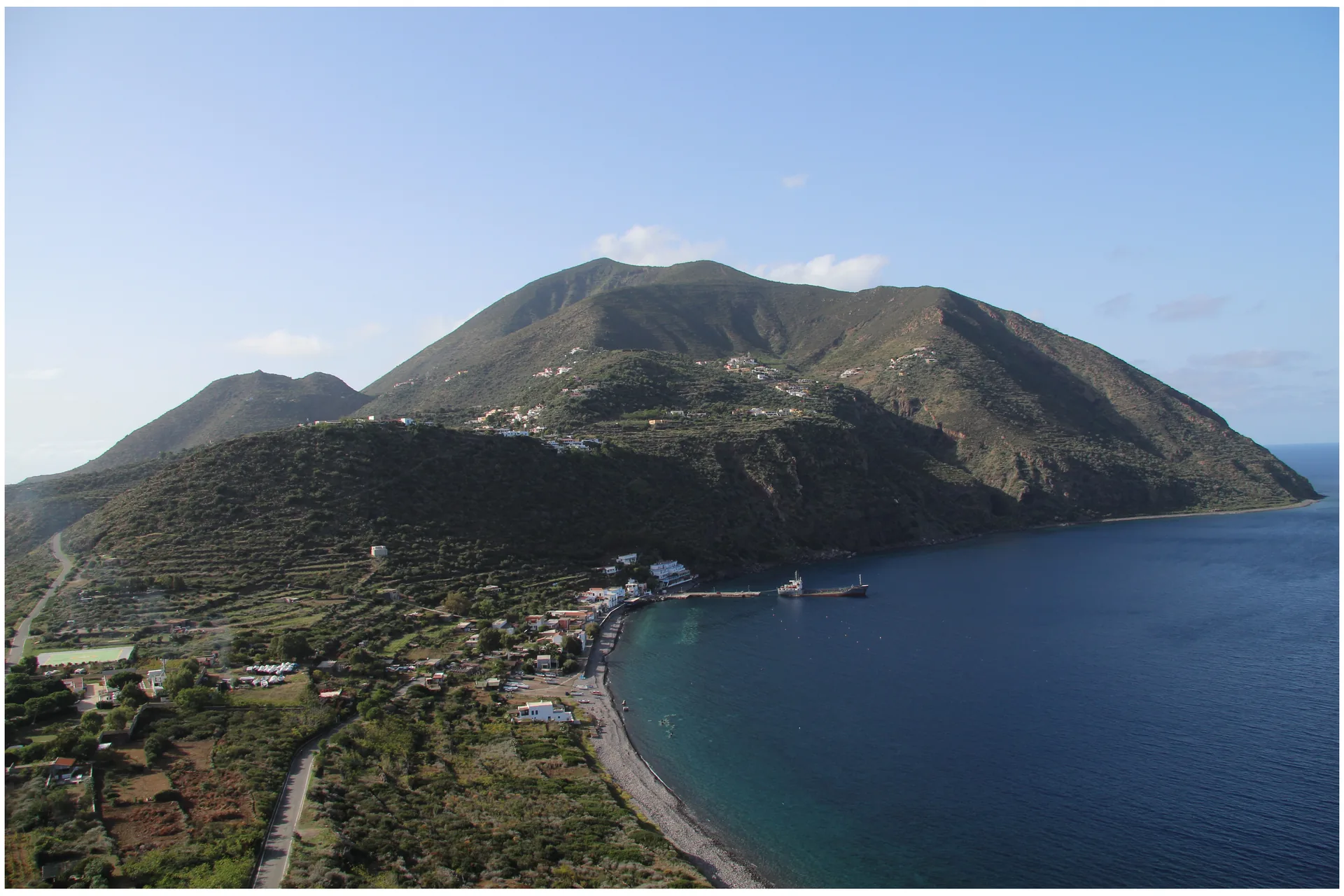 View of Filicudi Porto harbor and Monte Fossa delle Felci from the prehistoric settlement on the southern coast of Filicudi island