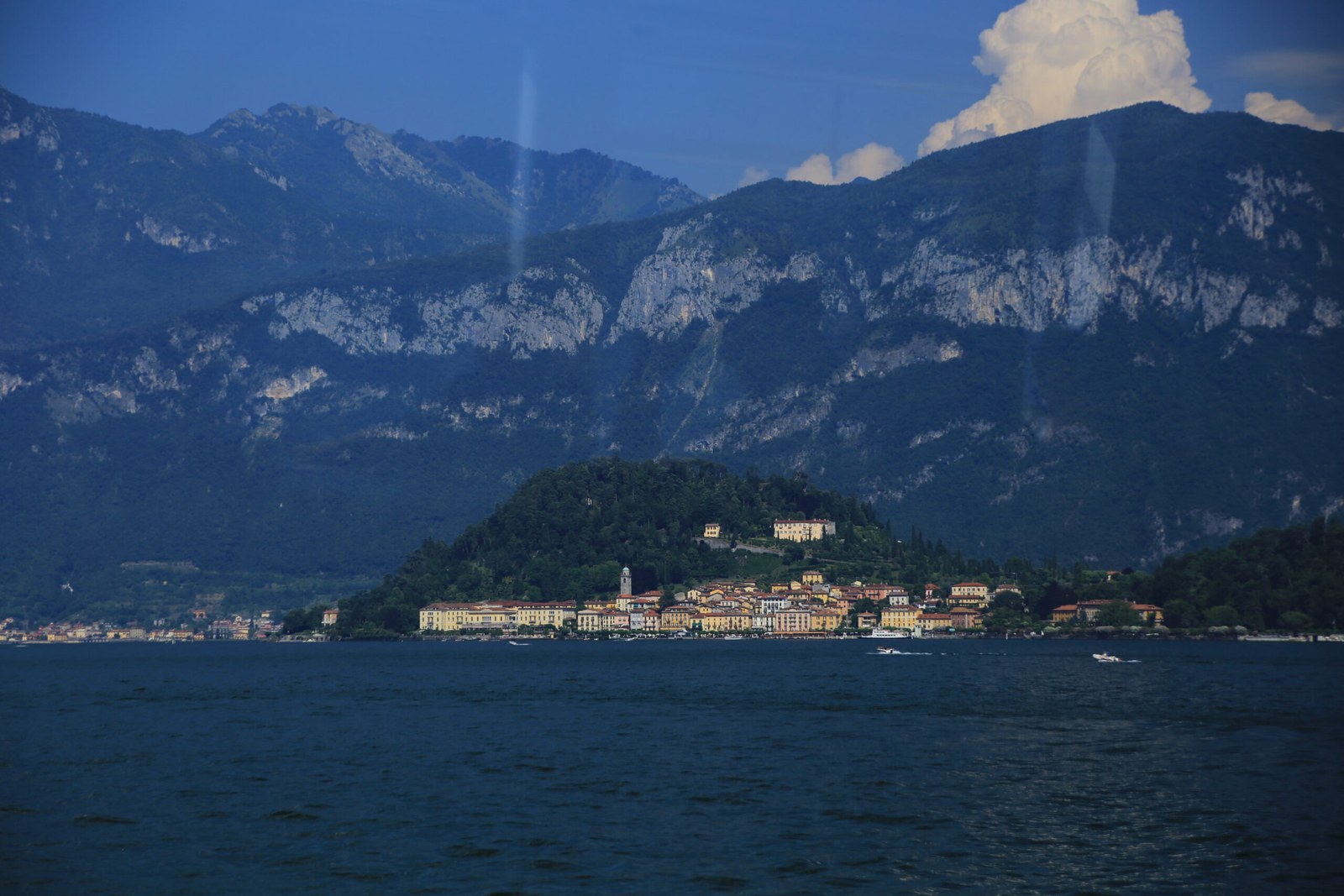 Bellagio promontory on Lake Como seen from the water with Alpine backdrop — Italy honeymoon lakes