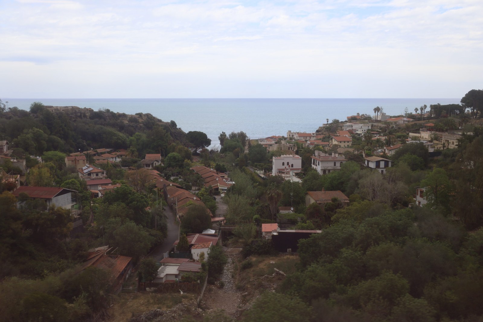 Agnone Bagni dark-sand beach south of Catania toward Syracuse