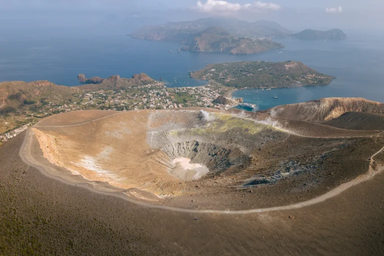 Aerial view of the Gran Cratere della Fossa on Vulcano with Lipari and the other Aeolian Islands in the background