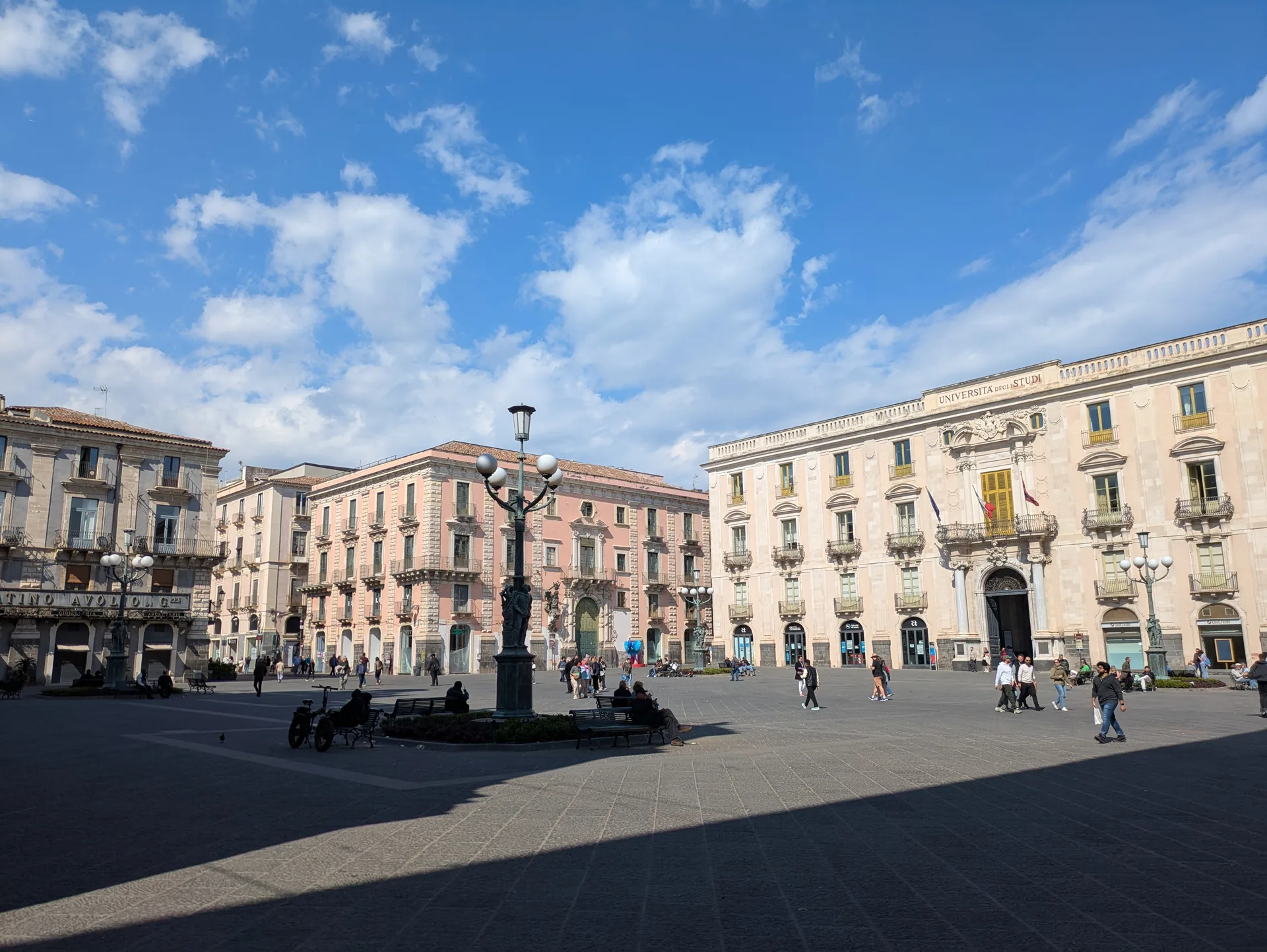 Piazza dell'Universita in Catania at evening with locals walking, a central walkable square for tourists