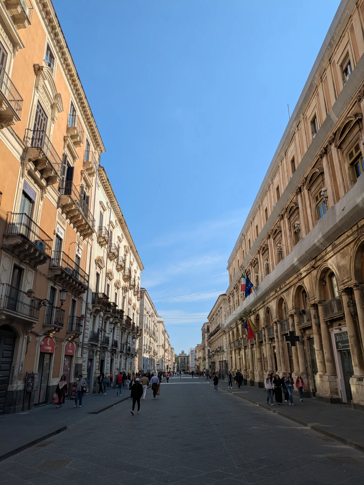 Families and pedestrians walking along Via Etnea in central Catania